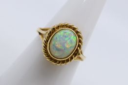 A 9ct yellow gold opal solitaire ring,