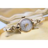 A lady's 9ct gold cased Accurist wrist watch on expanding rolled gold bracelet,