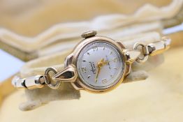 A lady's 9ct gold cased Accurist wrist watch on expanding rolled gold bracelet,