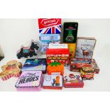 A large quantity of collectable tins to include confectionary, cosmetics, lunch box,