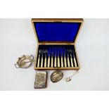 Lot to include a cased set of silver mounted flatware, silver mounted book of prayer,