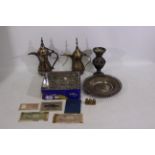 A collection to include shillings, new pence coins, brass and metal long spout pots,