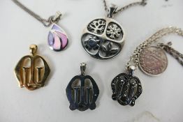 Six pendants of which one weighing 2.