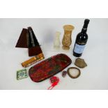 A mixed lot to include metronome, onyx vases, fossil, bottle of sweet Marsala and other.