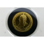 A replica (reduced size) 22ct gold Charles I Unite, 22 mm (d), 4 grams, encapsulated.