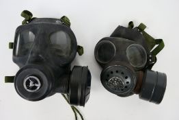 Two vintage gas mask respirators comprising an LBR Co cold war period example and one by Avon.