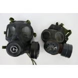 Two vintage gas mask respirators comprising an LBR Co cold war period example and one by Avon.