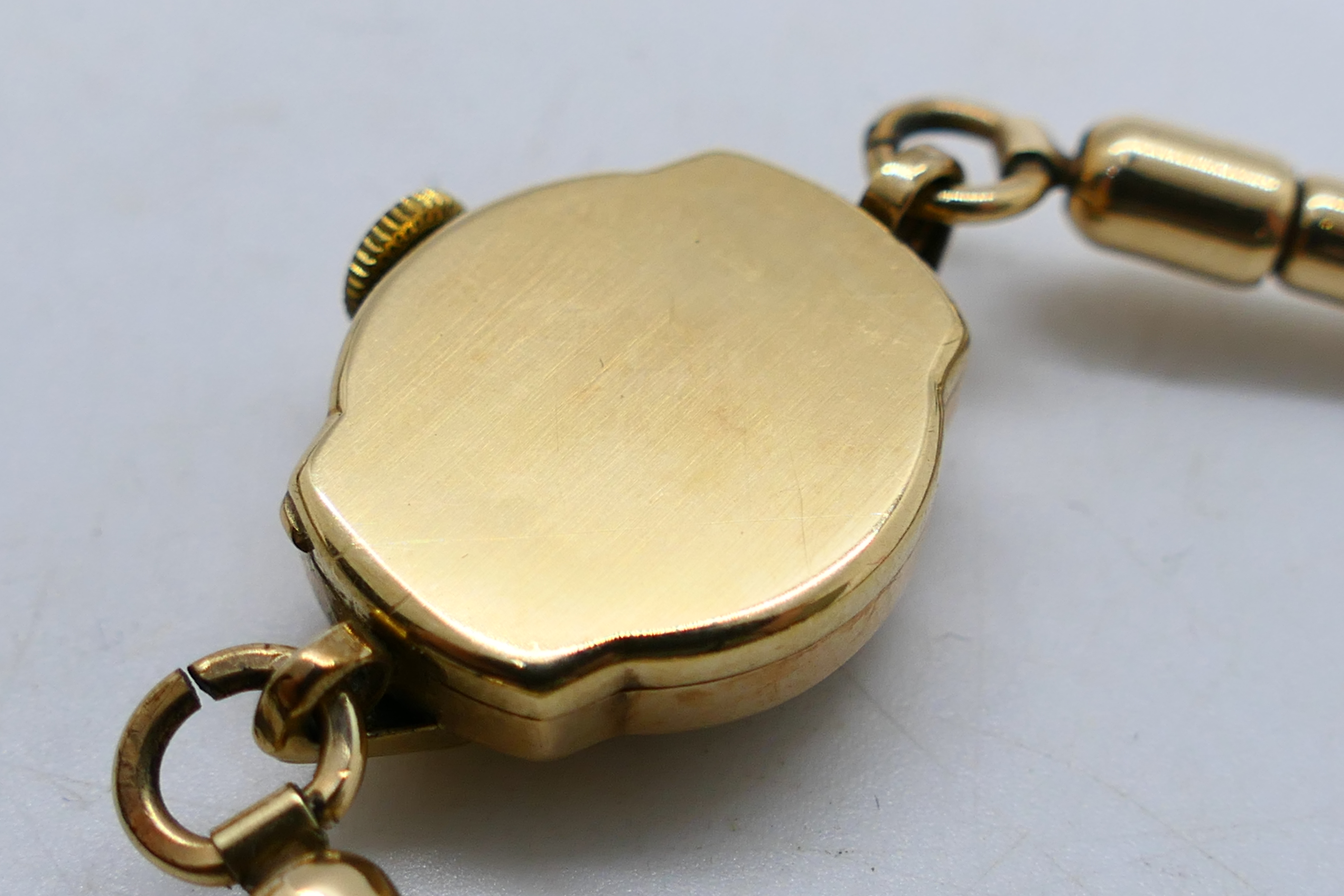 A lady's 9ct gold cased Accurist wrist watch on expanding rolled gold bracelet, - Image 6 of 6