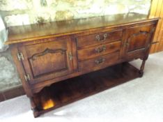 A good dark oak sideboard retailed by Arighi Bianchi, as illustrated,