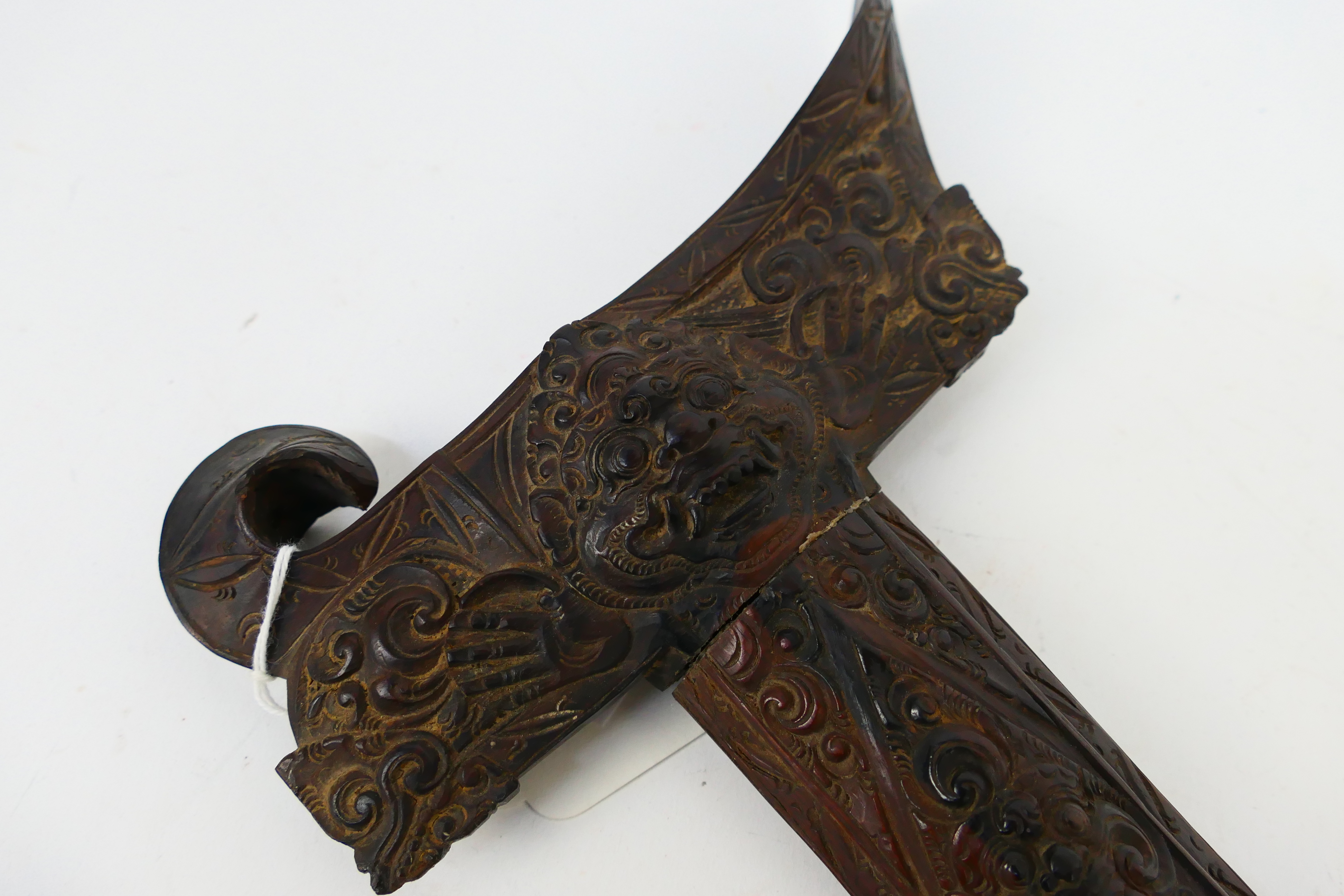 An Indonesian Kris with intricately carved scabbard and hilt, - Image 7 of 9