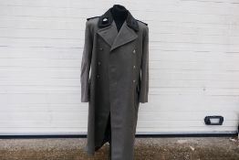A World War Two (WW2 / WWII) style German greatcoat with insignia.