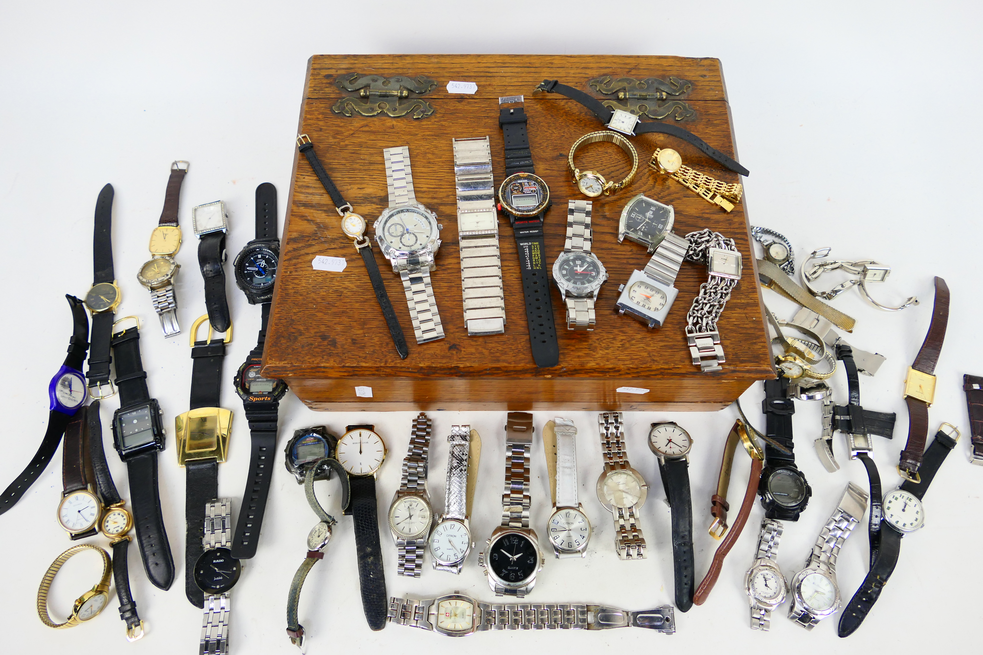 A box containing a large quantity of wrist watches, various makers.