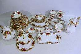 A quantity of Royal Albert Old Country Roses pattern dinner and tea wares, in excess of 55 pieces.