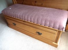 An Ottoman with pink upholstered top measuring 52 cm (h) x 126 cm (w) x 45.