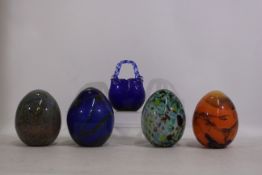 4 x unique egg-shaped glass items with interesting patterns.