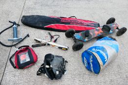 A collection of kite surfing equipment and accessories.