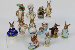 A collection of Beswick Beatrix Potter figures to include Lady Mouse, Benjamin Bunny, Mrs Rabbit,