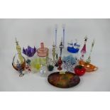 A collection of various glassware to include Egyptian perfume bottles, paperweights,