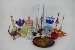 A collection of various glassware to include Egyptian perfume bottles, paperweights,