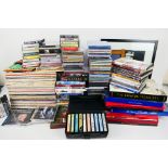 Lot to include 12" vinyl records, music cassettes, music related literature, DVDs and other,