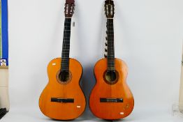 Two acoustic guitars comprising a Suzuki model # 3065 and one other.