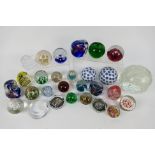 A collection of various paperweights, largest approximately 15 cm (d).