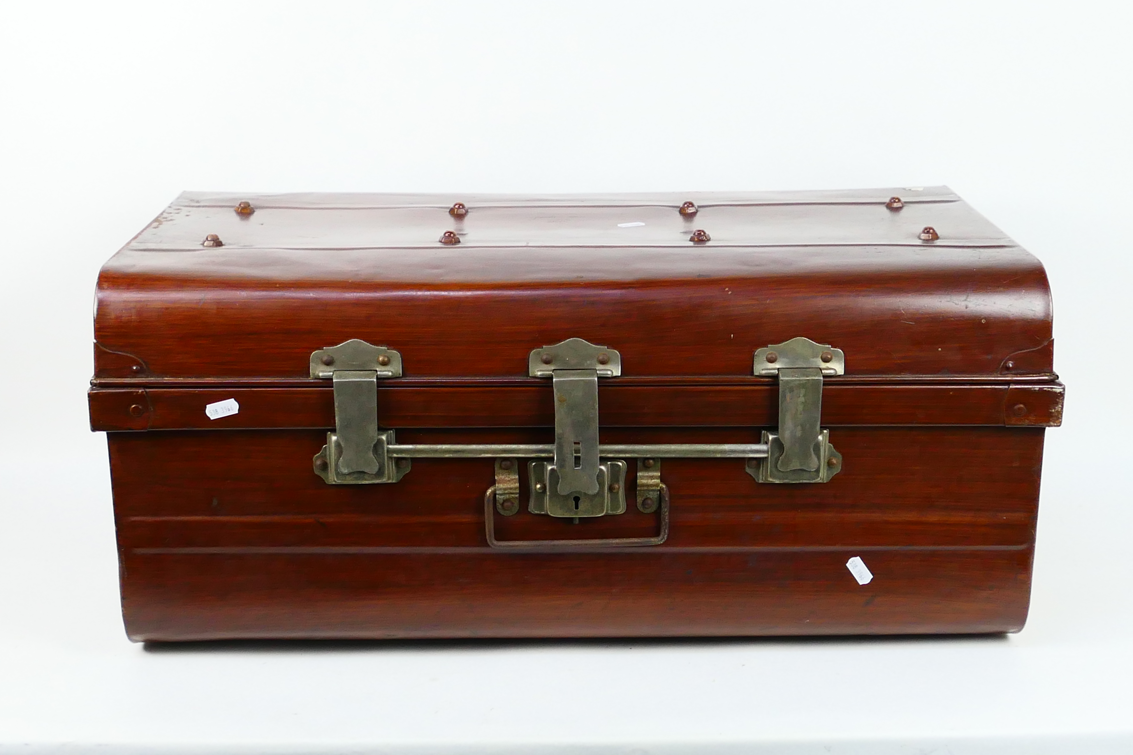 A large metal trunk, approximately 33 cm x 77 cm x 46 cm.