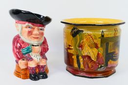 A Tams Ware Dickens Series jardiniere Mrs Gamp and a Shorter & Son Toby jug, 21 cm (h).