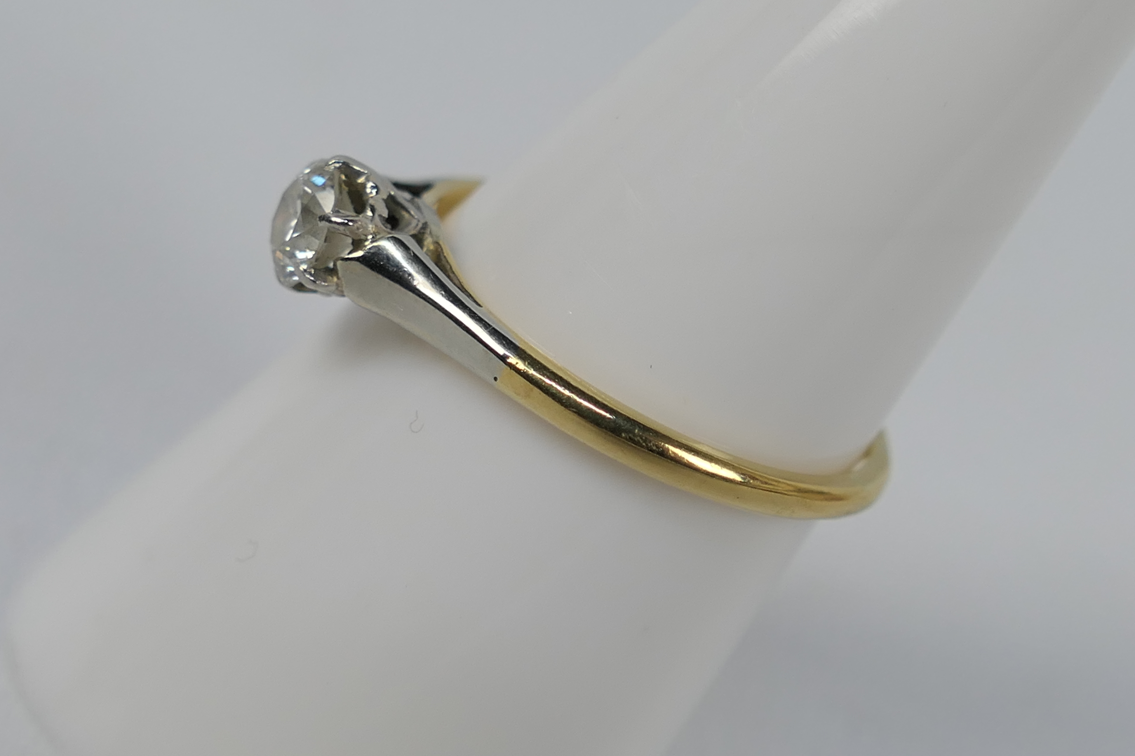 A two-tone, solitaire ring, stamped 18ct, size O, approximately 2.2 grams all in. - Image 2 of 4