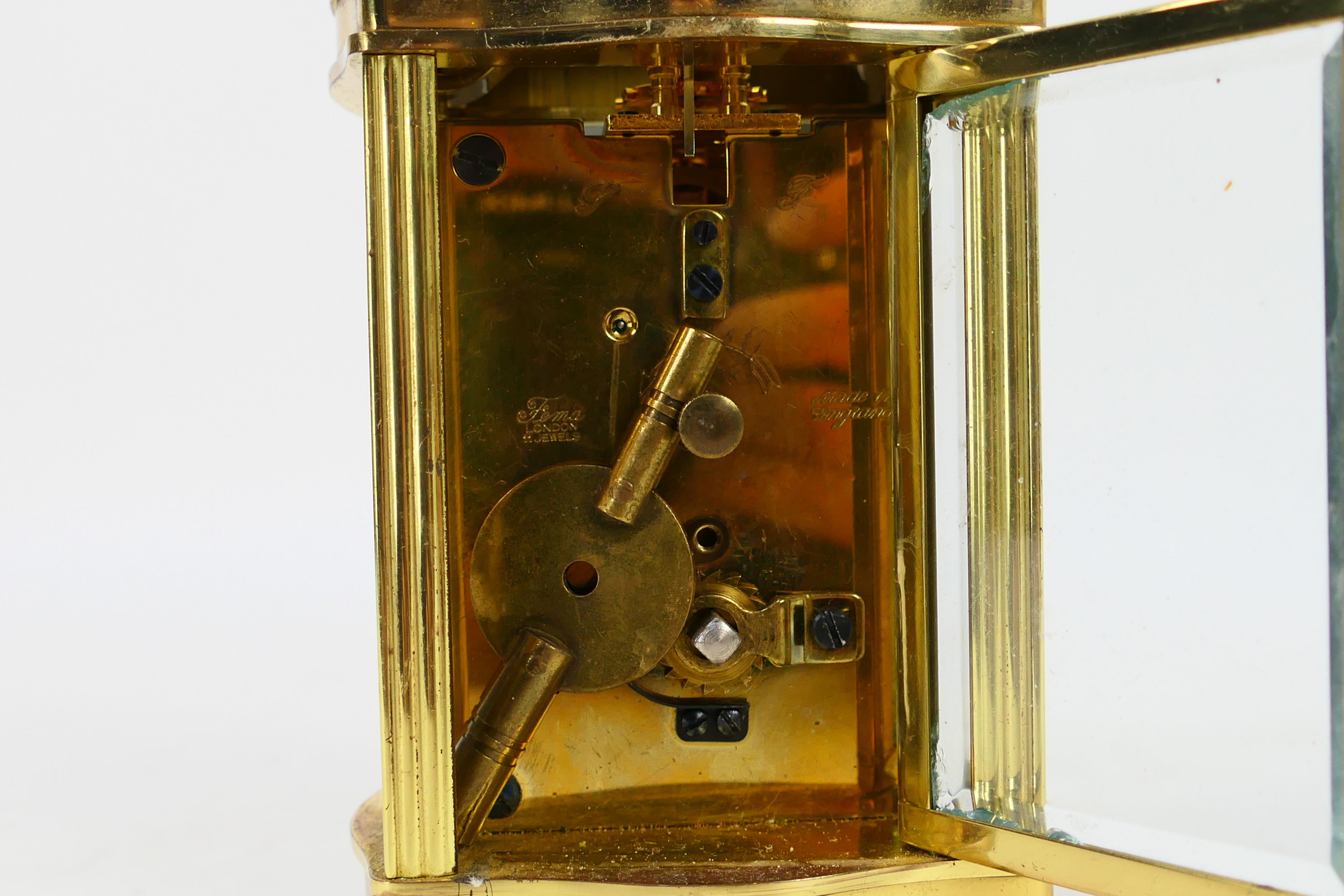 A brass and glass cased carriage clock, Roman numerals to a white dial, the dial signed Imperial, - Image 5 of 7