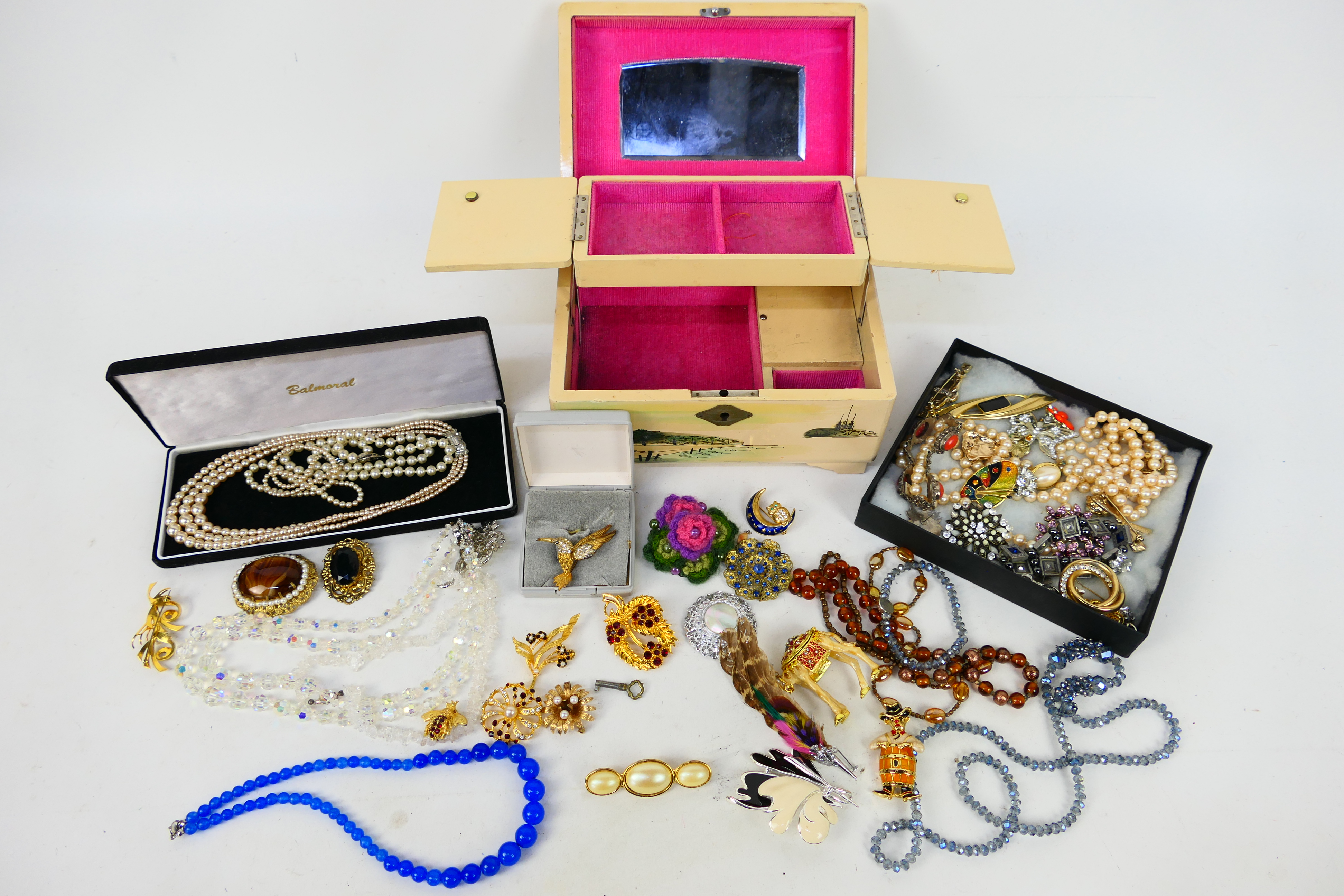 A collection of costume jewellery to include brooches, necklaces, bracelets, earrings and similar.