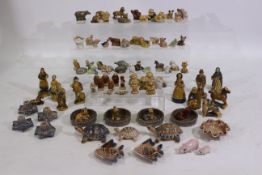 A quantity of Wade Whimsies and ornaments including animals, monks,