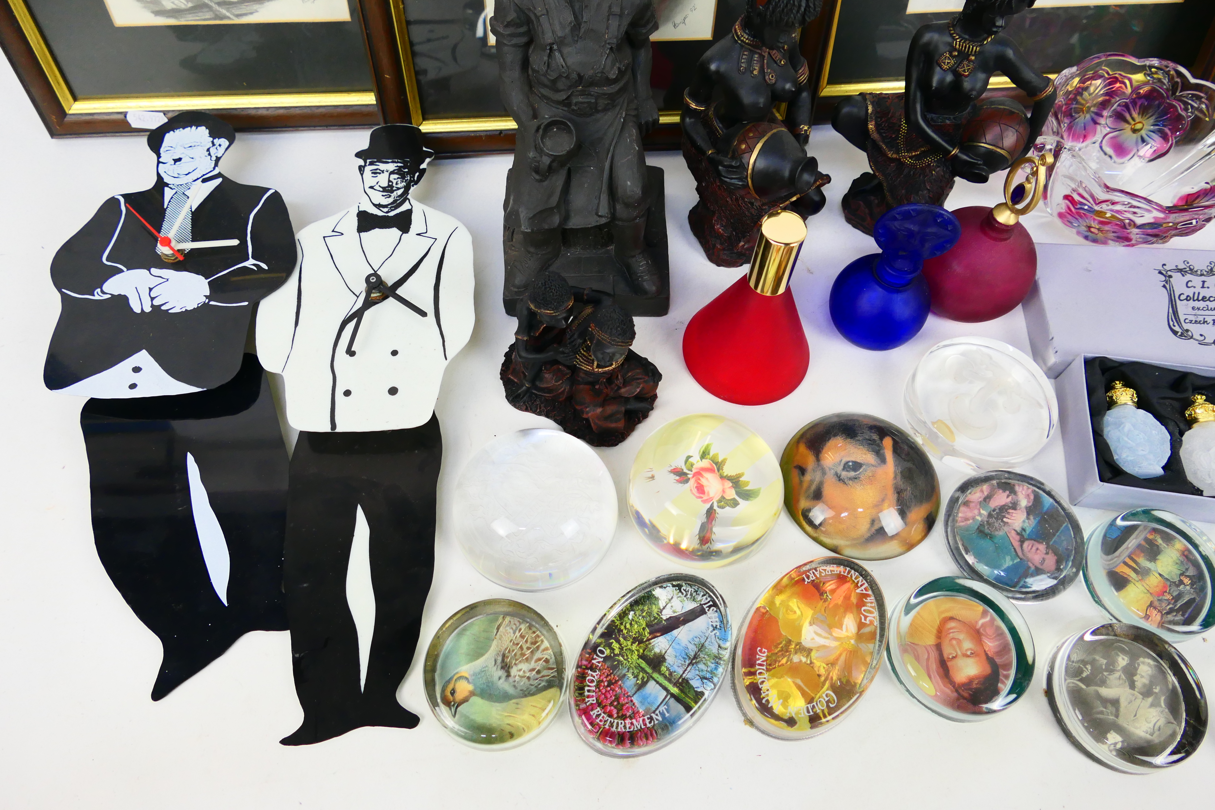 A mixed lot to include paperweights, Laurel & Hardy prints and wall clocks, various ornaments, - Image 3 of 7