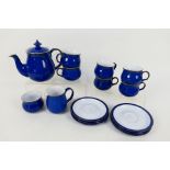 Denby - An Imperial Blue tea set comprising teapot, milk jug, sugar bowl and six cups and saucers.