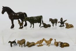 A collection of bronze figures of animals to include horse, bull / cows, sheep, birds,