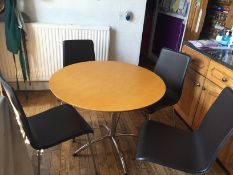 A 1960s style circular topped table and four chairs by Julian Bowen,