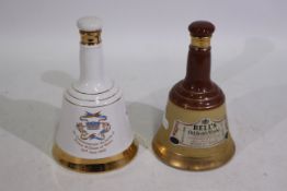 Two Bell's whisky decanters, 50cl and 40% ABV, one a royal commemorative.
