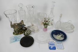 A quantity of glassware to include decanters, vases and other, model elephants,