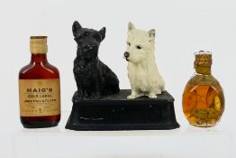 A cast aluminium Black & White Whisky advertising model 13 cm (h),