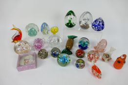 A quantity of paperweights to include Avondale Glass,