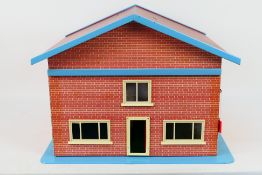 Unknown Maker - A wooden two storey dolls house measuring 53 x 46 x 40 cm.