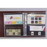 Philately - Two albums of Royal Mail Mint Stamp Presentation Packs, in excess of £420 face value.