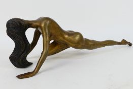 A cast bronze model depicting a female nude, approximately 49 cm (l).