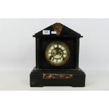 A late 19th or early 20th century black marble cased mantel clock by Ansonia,