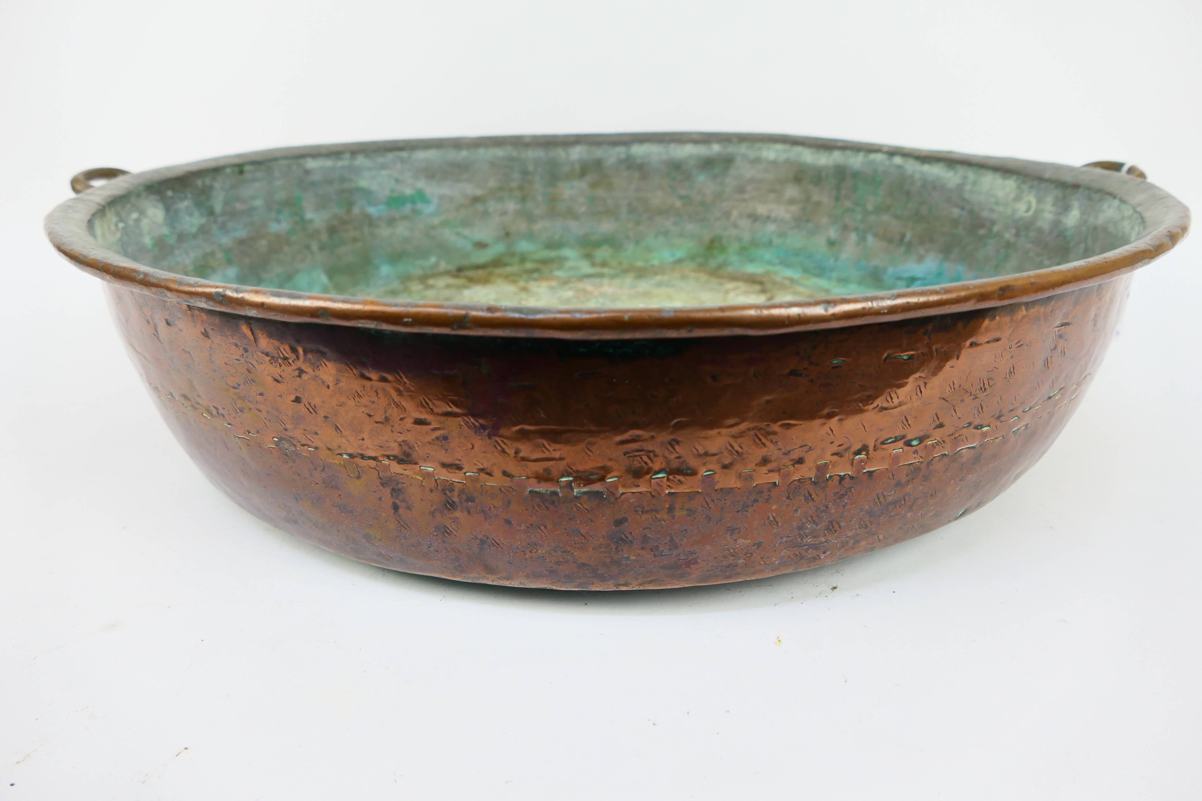 A large, antique, twin handled copper bowl, - Image 4 of 4