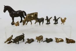 A quantity of bronze animal figures to include horse, cows, sheep, birds and other,