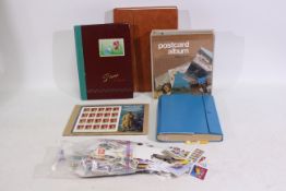 Philately - A collection of UK and foreign stamps contained in albums and loose and a quantity of