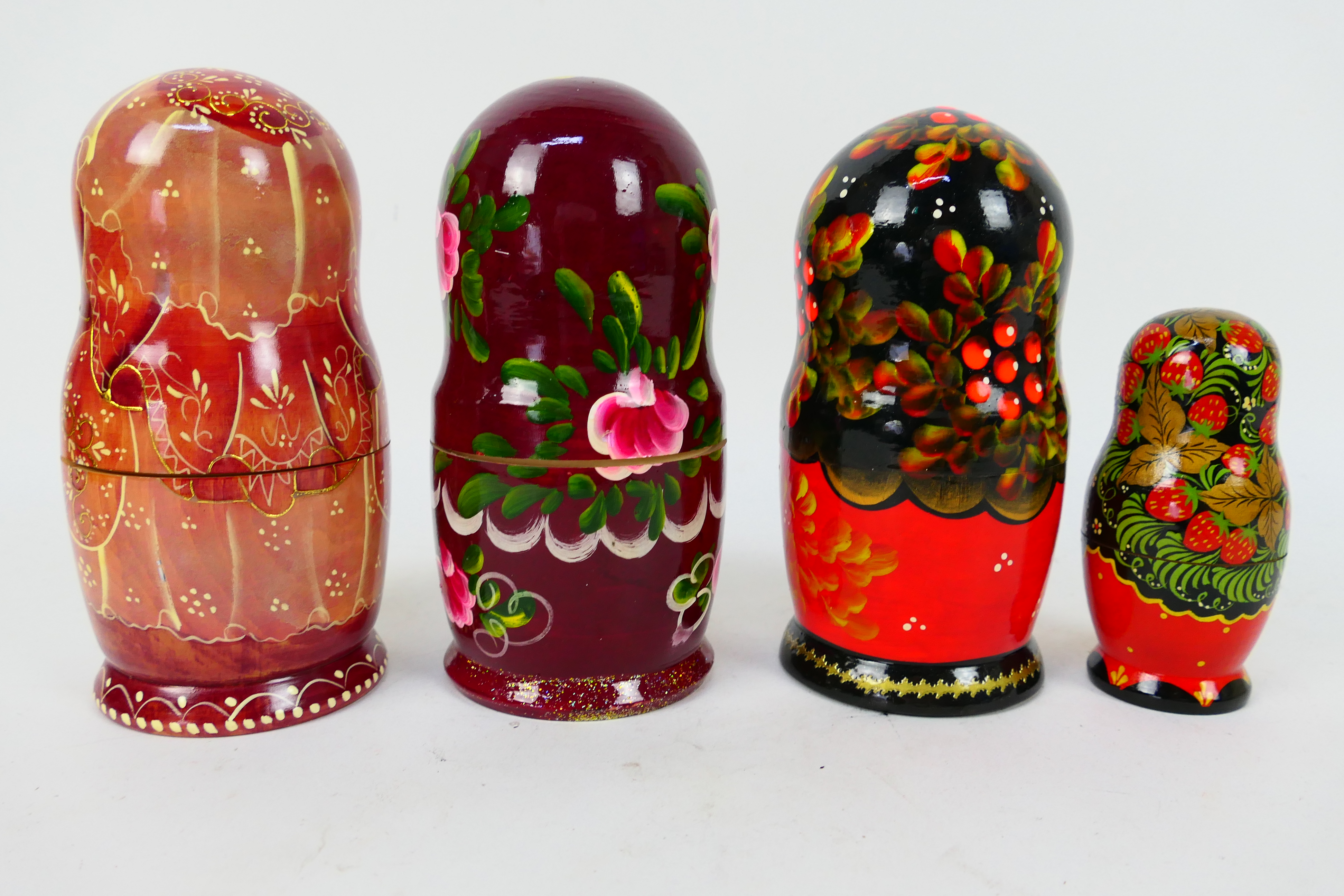 Four sets of Russian matryoshka nesting dolls, largest approximately 17 cm (h). - Image 2 of 3