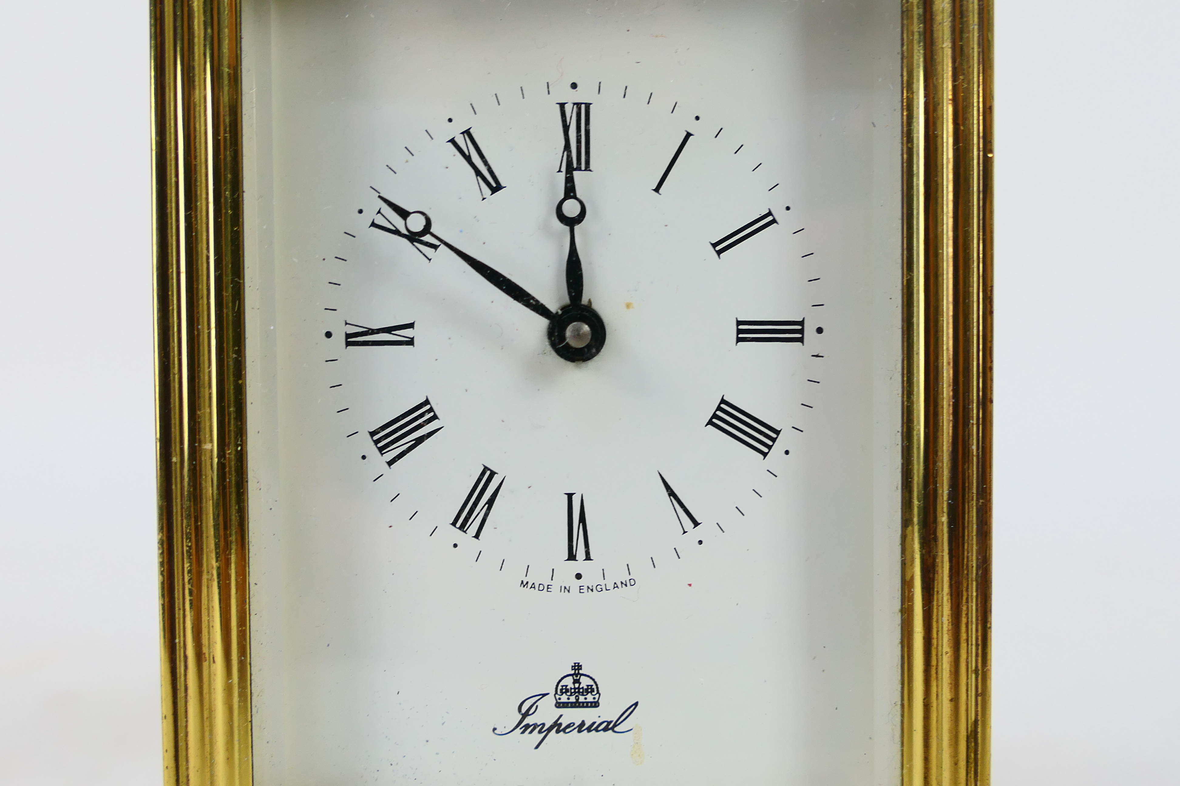 A brass and glass cased carriage clock, Roman numerals to a white dial, the dial signed Imperial, - Image 2 of 7