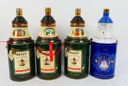 Four commemorative Bells whisky decanters comprising a Queen Mother 90th birthday,